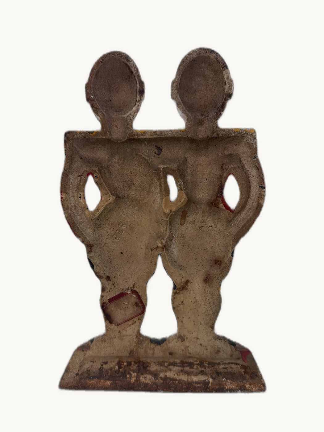 Back view of the antique Hubley cast iron footmen doorstop showing original paint and patina