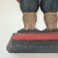 Close-up of the "Fish / 272" maker's mark stamped on the base of the antique Hubley footmen doorstop